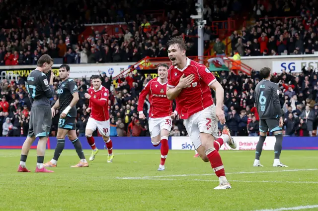 Callum Doyle celebrates putting Wrexham 4-3 up against Wrexham