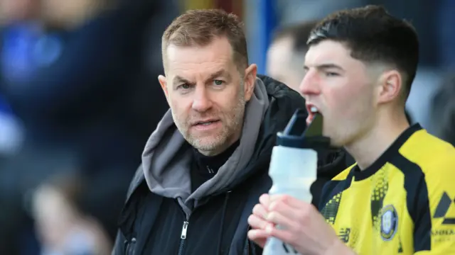 Harrogate manager Simon Weaver pictured on the touchline during the game against Chesterfield