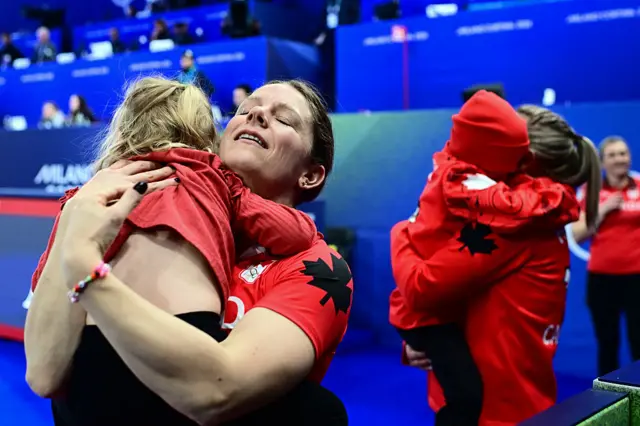 Canada's curling team celebrating