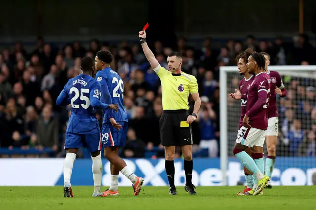 Wesley Fofana of Chelsea is shown a red card by match referee Lewis Smith
