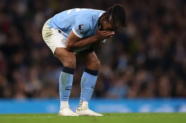 Semenyo puts his head in his hands after missing a chance