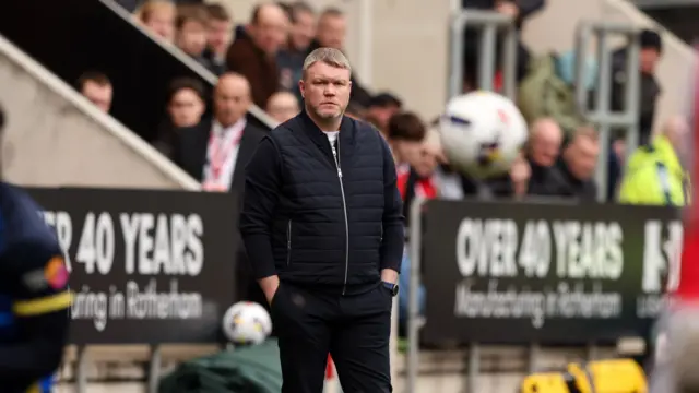 Doncaster Rovers boss Grant McCann watching his team from the technical area