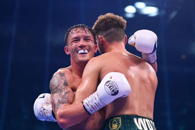 Josh Warrington hugs Leigh Wood