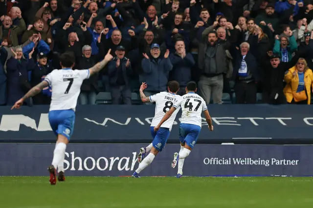John Swift celebrates putting Portsmouth 2-0 up at Millwall