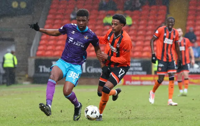 Kilmarnock's Aaron Tshibola and Dundee United's Amar Fatah