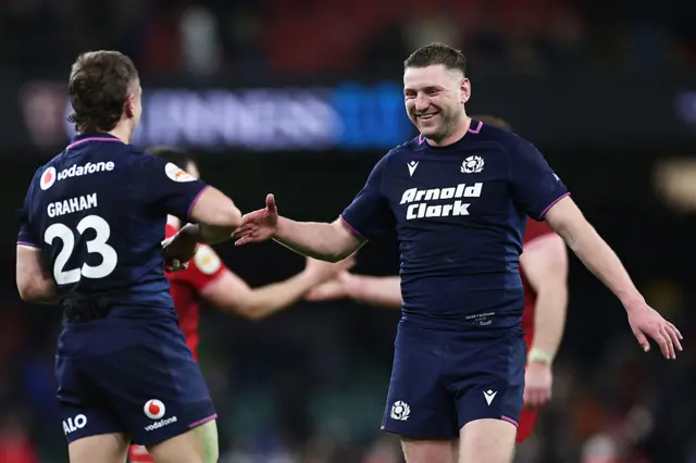 Finn Russell high fives Darcy Graham