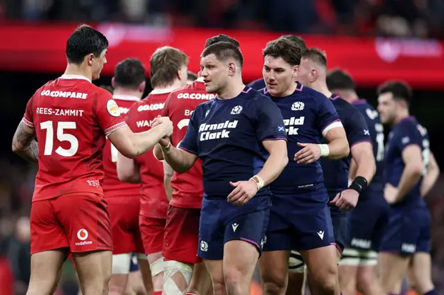 Players shaking hands after the game