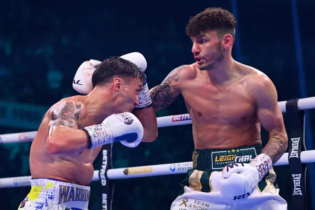 Leigh Wood lands a punch on Josh Warrington