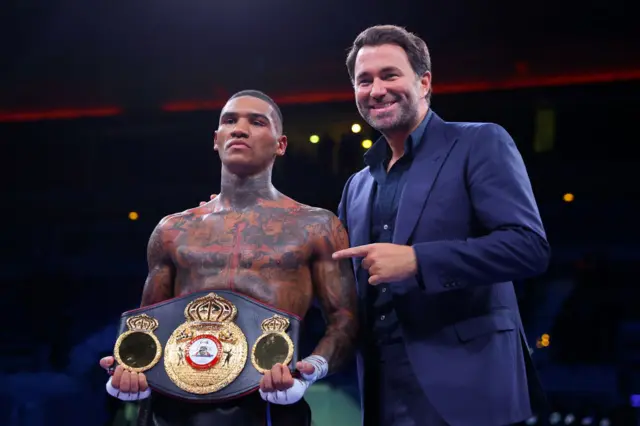 Conor Benn holds the WBA continental welterweight belt and stands next to Eddie Hearn
