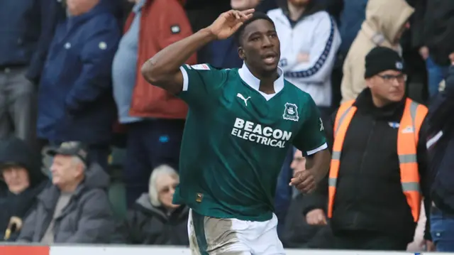 Bim Pepple runs away with his arm in the air after scoring for Plymouth against Cardiff