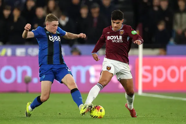 Mateus Fernandes of West Ham United is challenged by Adrien Truffert of AFC Bournemouth