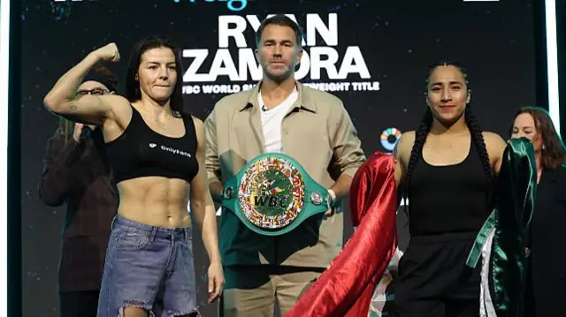 Sandy Ryan holds up her arm, Eddie Hearn holds the WBC light-welterweight title and Karla Ramos Zamora holds the Mexican flag