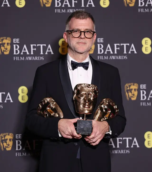 Paul Thomas Anderson with his three Baftas