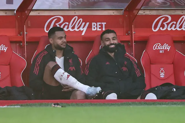 Cody Gakpo and Mohamed Salah of Liverpool on the bench
