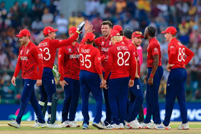Jamie Overton and teammates of England celebrate the wicket of Dushan Hemantha of Sri Lanka