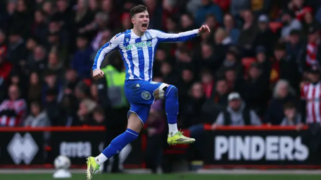 Charlie McNeill celebrates scoring