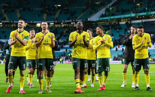 Hibs fans applaud the visiting fans at Celtic Park