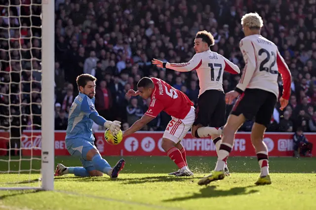 Curtis Jones of Liverpool shoots under pressure from Murillo of Nottingham Forest, as Stefan Ortega of Nottingham Forest makes the save during the Premier League match between Nottingham Forest and Liverpool at City Ground on February 22, 2026 in Nottingham, England. (