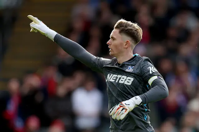 Crystal Palace's Dean Henderson saves a penalty kick