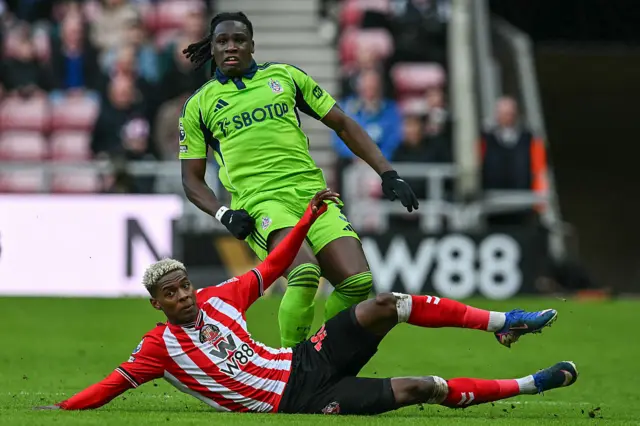Sunderland's Ecuadorian striker #10 Nilson Angulo (bottom) tackles Fulham's Italian-born Nigerian defender #03 Calvin Bassey