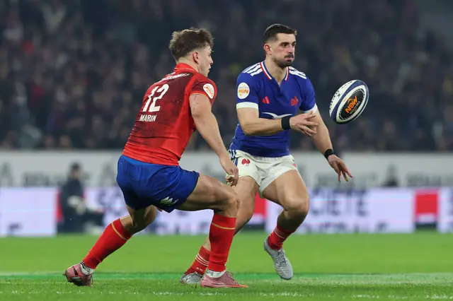 Thomas Ramos of France offloads the ball