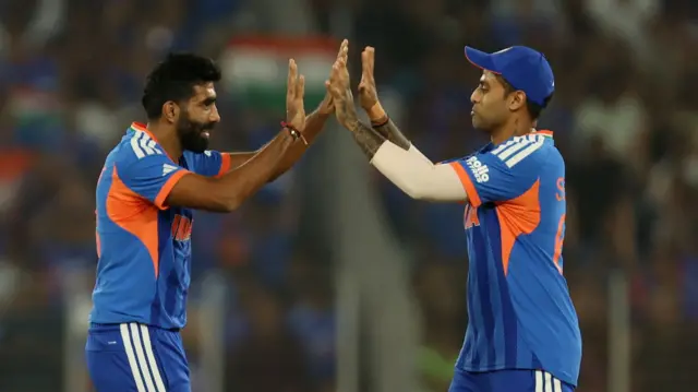 India's Jasprit Bumrah celebrates with Suryakumar Yadav after taking the wicket of South Africa's Ryan Rickelton