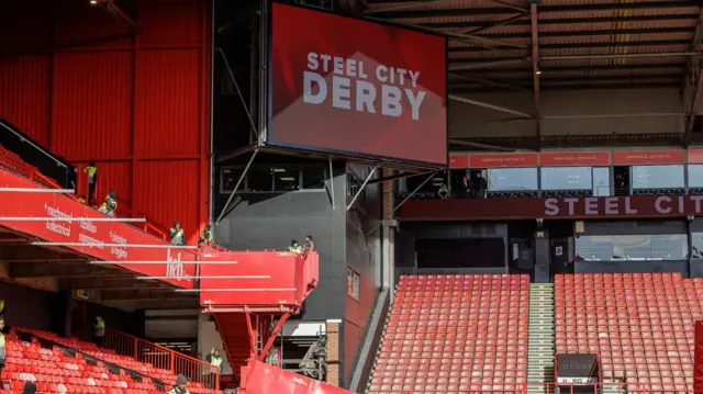 A view of the big screen at Bramall Lane that says 'Steel City Derby'
