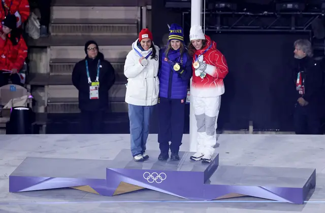 Gold medalist Ebba Andersson of Team Sweden, Silver medalist Heidi Weng of Team Norway, and Bronze medalist Nadja Kaelin of Team Switzerland