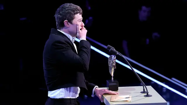 Robert Aramayo breaks down in tears on stage after winning best actor