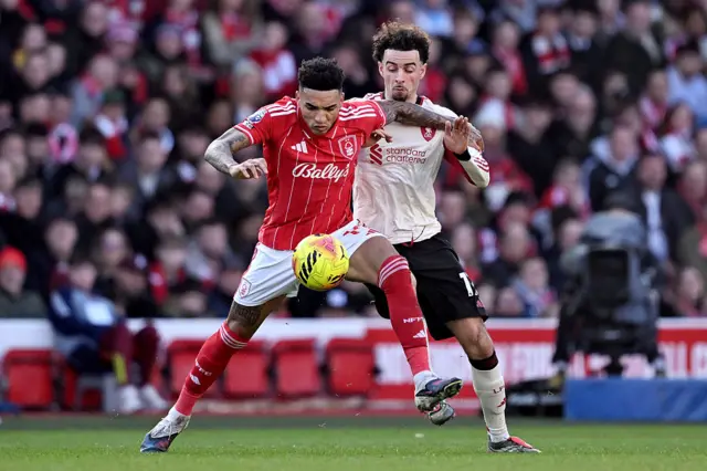 Igor Jesus of Nottingham Forest is challenged by Curtis Jones of Liverpool