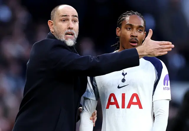Igor Tudor, Manager of Tottenham Hotspur, gestures as he holds the arm of Djed Spence