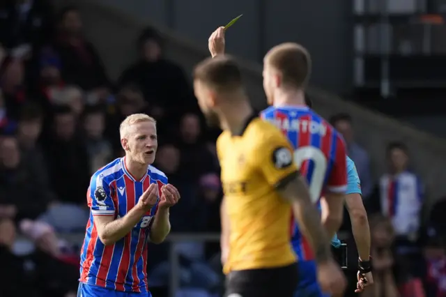 Crystal Palace's Will Hughes reacts after being shown a yellow card