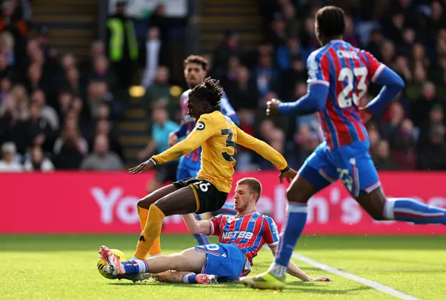 Mateus Mane of Wolverhampton Wanderers is fouled by Adam Wharton