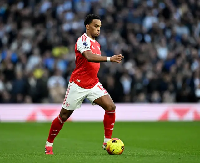 Jurrien Timber of Arsenal runs with the ball