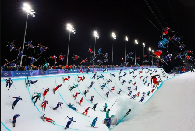 Digital composite showing duplicate images of skiers on a halfpipe