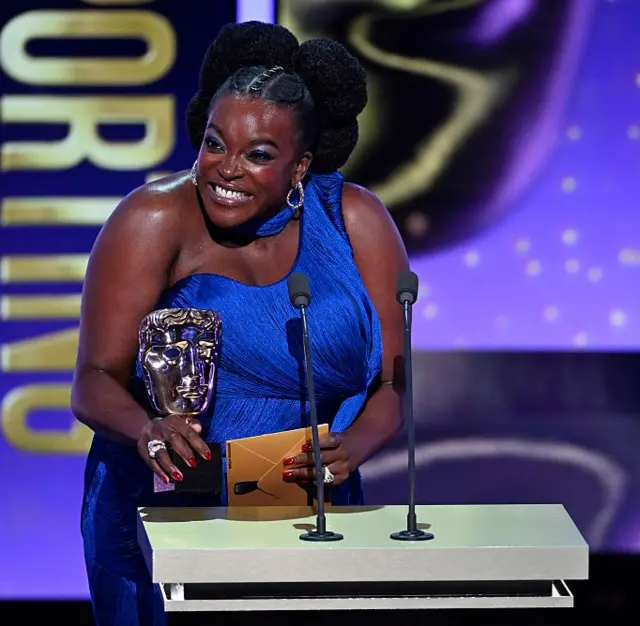 Wunmi Mosaku accepts the Supporting Actress Award for 'Sinners' on stage during the EE BAFTA Film Awards 2026