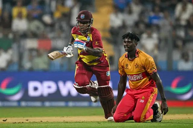 Shimron Hetmyer (L) runs between the wickets