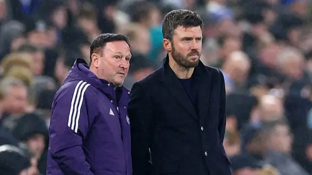 Carrick chats to his assistant Holland