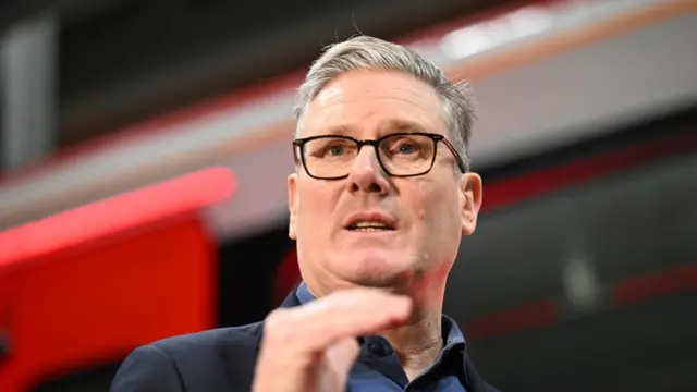 A file photo of Keir Starmer - he gestures with his hand as he speaks to an audience off camera