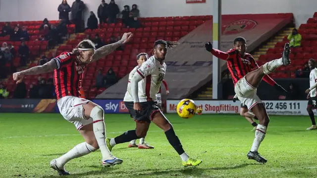 Walsall's Aden Flint takes a shot at goal