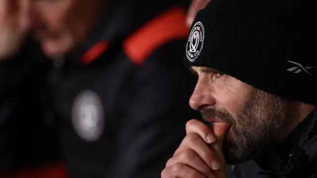 MK Dons boss Paul Warne looks pensive at kick-off