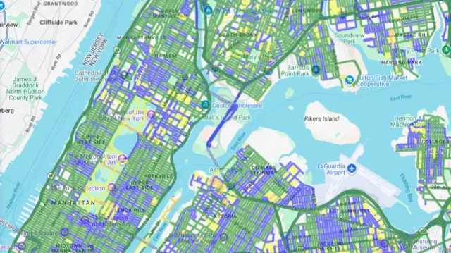 A map of New York City with coloured lines over all of the streets. It shows that the majority of the streets are coloured green, with a few yellow and orange.