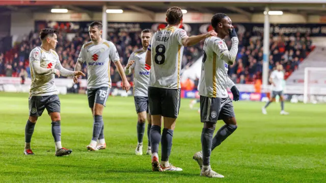 Rushian Hepburn-Murphy celebrates with his MK Dons team-mates