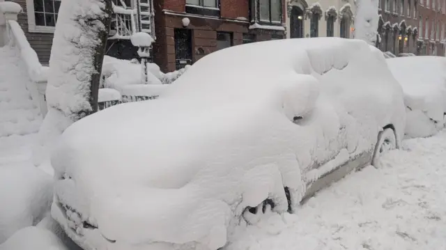 A car covered in snow
