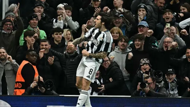 Newcastle United's Italian midfielder #08 Sandro Tonali celebrates after scoring their first goal during the UEFA Champion's League knockout round play-off