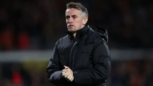 Ipswich head coach Kieran McKenna applauding fans