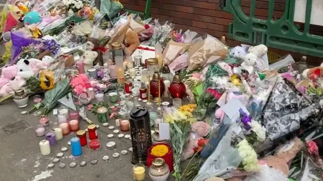 Floral tributes and other memorials left at the scene