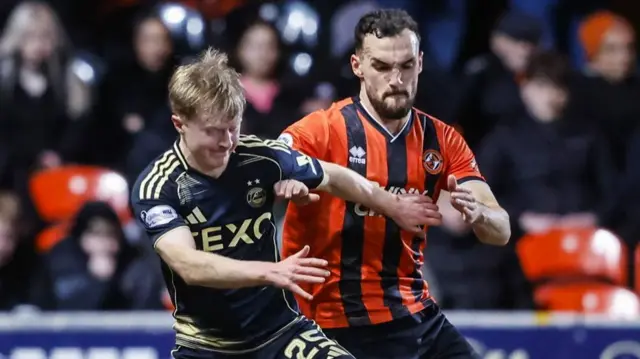 Dundee's Vicko Sevelj (R) and Aberdeen's Lyall Cameron (L) in action during a William Hill Premiership match between Dundee United and Aberdeen at the CalForth Construction Arena at Tannadice Park