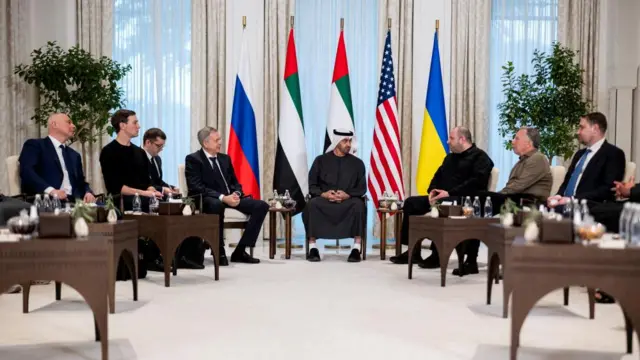 We can see eight men sat in the photo in a palace in Abu Dhabi. At the centre is President of the United Arab Emirates Sheikh Mohamed bin Zayed Al Nahyan with Ukrainian, US, and Russian officials on either side