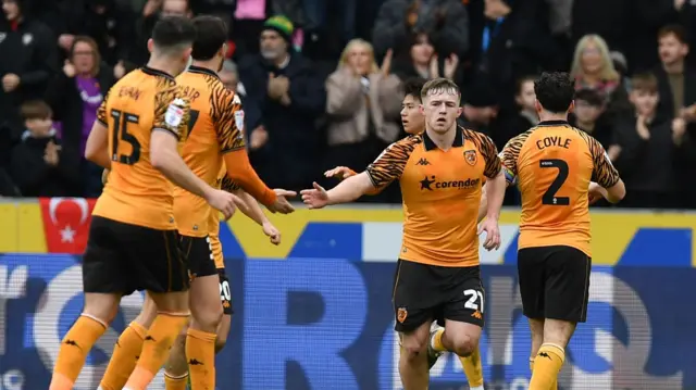 Hull City players celebrate a goal in the 3-1 loss to QPR